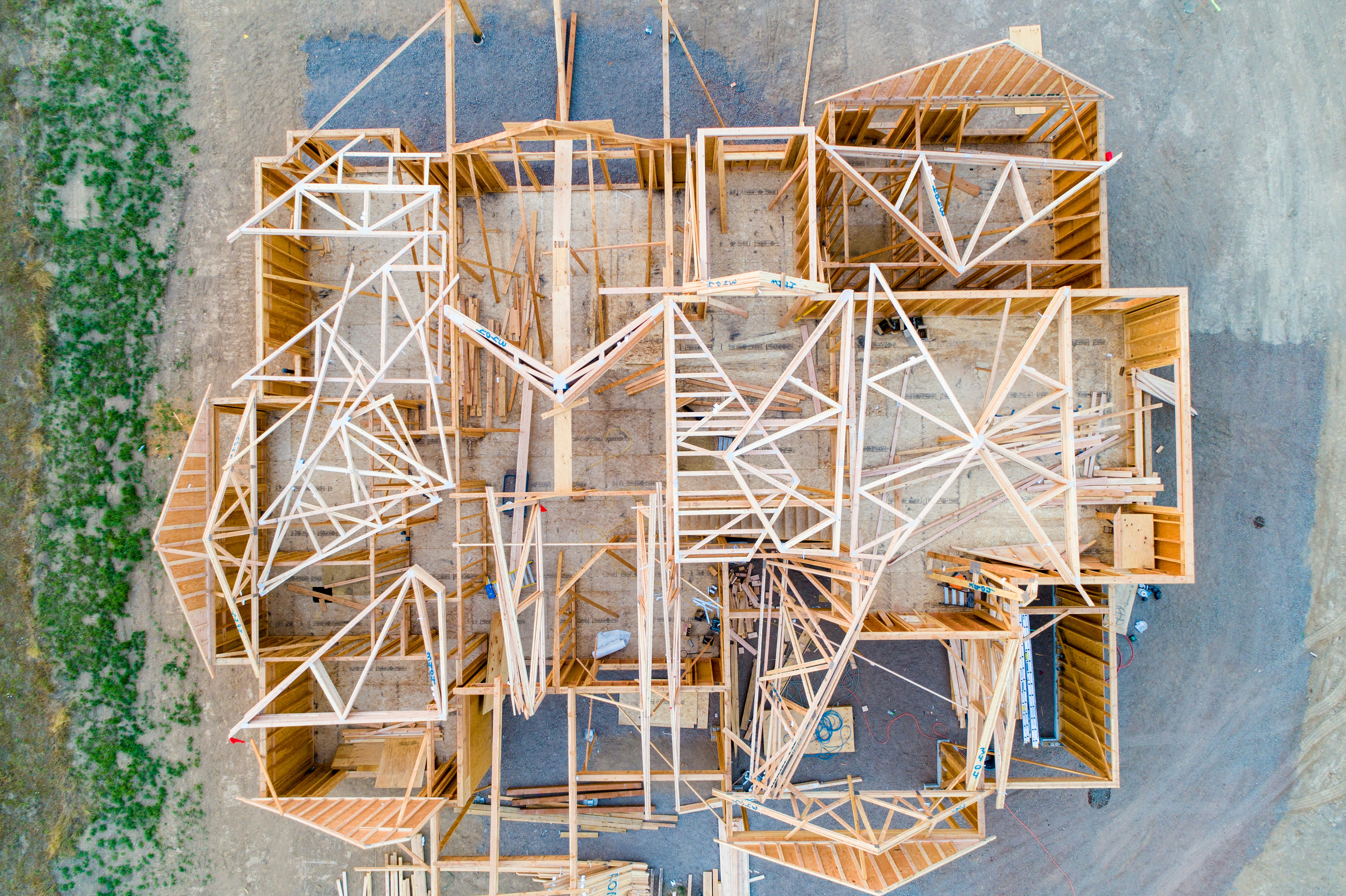 Aerial view of wood-framed house under construction